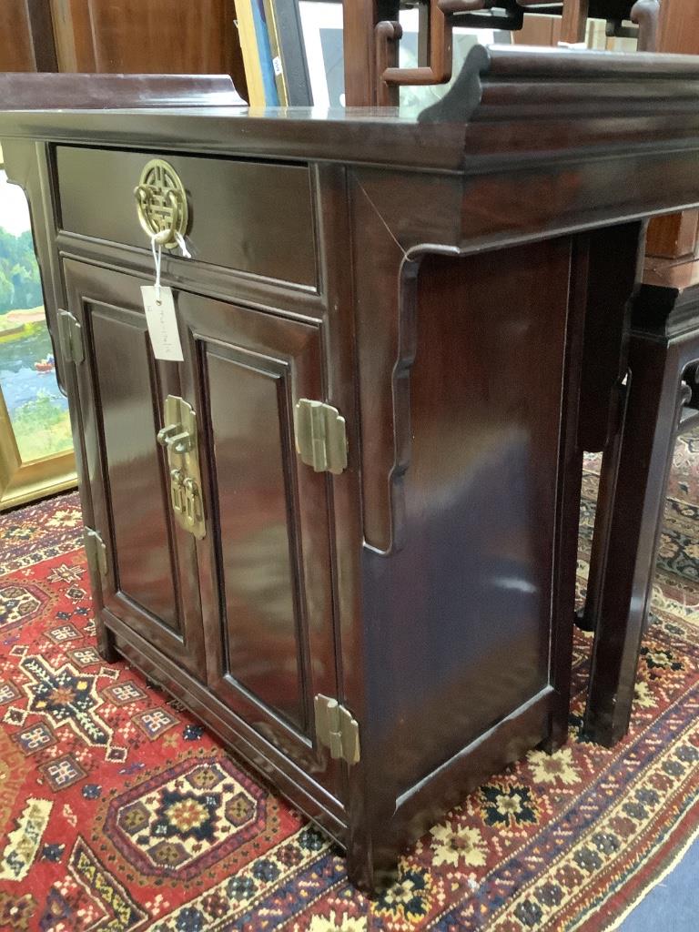 A 20th century Chinese hardwood low cabinet, with brass-fitted drawer and cupboard, width 74cm depth 36cm height 75cm
